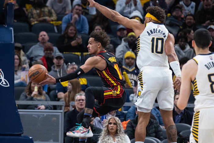 Mar 28, 2022; Indianapolis, Indiana, USA; Atlanta Hawks guard Trae Young (11) passes the ball while Indiana Pacers forward Justin Anderson (10) defends in the second half at Gainbridge Fieldhouse.